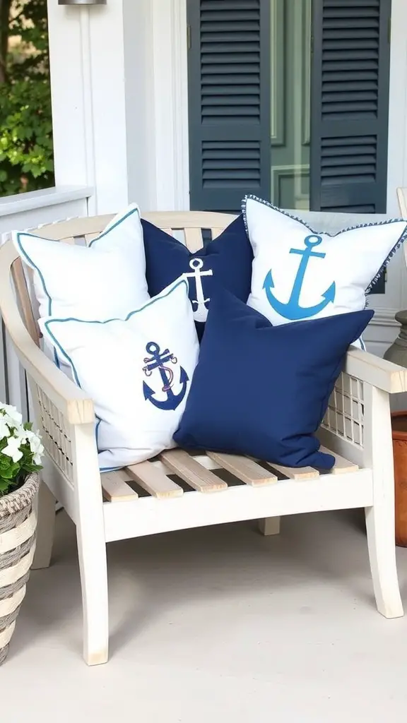 A cozy porch with nautical-themed throw pillows in blue and white, featuring anchor designs, on a wooden chair.